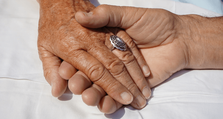 seniors holding hands