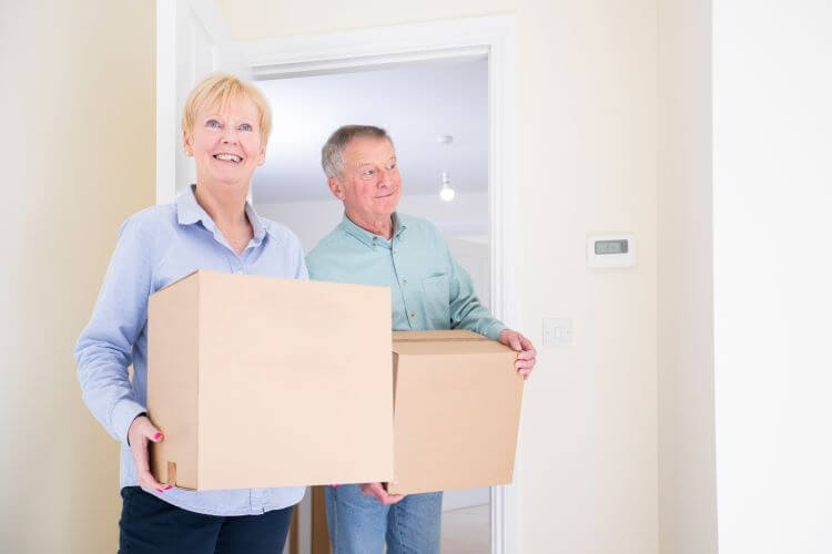 Senior couple moving into a new home.